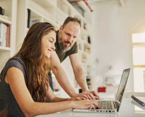 parent homeschooling his student during Covid-19